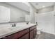 This bathroom features a double vanity and bath and shower combo at 2943 W Thorn Tree Dr, Phoenix, AZ 85085