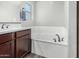 This bathroom features a soaking tub with a sleek, modern faucet at 2943 W Thorn Tree Dr, Phoenix, AZ 85085