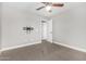 This bedroom features neutral walls, carpet and an adjacent room at 2943 W Thorn Tree Dr, Phoenix, AZ 85085