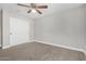 This bedroom features carpet, neutral paint and closet at 2943 W Thorn Tree Dr, Phoenix, AZ 85085