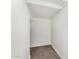 This is a walk-in closet, with neutral gray carpeting, white walls, and white baseboards at 2943 W Thorn Tree Dr, Phoenix, AZ 85085