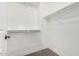 Walk-in closet with upper shelves and a lower clothing rod to maximize storage at 2943 W Thorn Tree Dr, Phoenix, AZ 85085