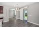 Dining room featuring modern light fixture and sliding glass door to backyard at 2943 W Thorn Tree Dr, Phoenix, AZ 85085