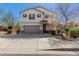 Two-story home featuring a two-car garage, neutral stucco, and a brick-paved driveway with tidy landscaping at 2943 W Thorn Tree Dr, Phoenix, AZ 85085