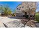 Two-story home featuring a two-car garage, neutral stucco, and a brick-paved driveway with landscaping at 2943 W Thorn Tree Dr, Phoenix, AZ 85085