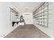Spacious garage with installed shelving for storage and organizational solutions at 2943 W Thorn Tree Dr, Phoenix, AZ 85085