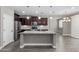 Modern kitchen features a large island and stainless steel appliances at 2943 W Thorn Tree Dr, Phoenix, AZ 85085