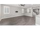 Bright living room features wood floors, white trim, and a ceiling fan at 2943 W Thorn Tree Dr, Phoenix, AZ 85085