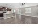 Open-concept living room showcases wood floors and a seamless flow to kitchen at 2943 W Thorn Tree Dr, Phoenix, AZ 85085
