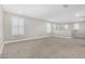 This upper living room is complete with plush carpeting and shuttered windows, offering a versatile living space at 2943 W Thorn Tree Dr, Phoenix, AZ 85085