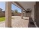 Covered patio with brick pavers and direct access to a manicured backyard at 2943 W Thorn Tree Dr, Phoenix, AZ 85085