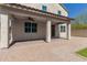 View of the covered patio featuring tile flooring and overlooking the backyard at 2943 W Thorn Tree Dr, Phoenix, AZ 85085