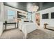Serene bedroom with neutral tones, a decorative chandelier, and large windows for natural light at 3396 E Open Prairie Dr, San Tan Valley, AZ 85140
