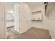 Spacious walk-in closet with shelving and plenty of room for storage, adjacent to the bathroom at 3396 E Open Prairie Dr, San Tan Valley, AZ 85140