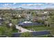 Expansive aerial view of a residential area with well-maintained lawns, mature trees, and scenic mountain views at 345 W Gardenia Dr, Phoenix, AZ 85021