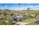 Beautiful home with mature trees, palm trees, and lush landscaping, as seen from an aerial perspective at 345 W Gardenia Dr, Phoenix, AZ 85021