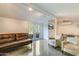 Finished basement showcasing neutral tones, French doors leading to the yard, and comfortable seating at 345 W Gardenia Dr, Phoenix, AZ 85021