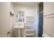 Bathroom showcasing a classic pedestal sink, mirrored wall cabinet and walk-in shower at 345 W Gardenia Dr, Phoenix, AZ 85021