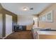 This bedroom features neutral walls, a bed, a desk, and a closet at 345 W Gardenia Dr, Phoenix, AZ 85021