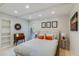 Bright bedroom with neutral decor, a queen size bed, and decorative wall art at 345 W Gardenia Dr, Phoenix, AZ 85021