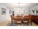 Bright dining room with a wooden table set, light wood floors and decorative modern lighting at 345 W Gardenia Dr, Phoenix, AZ 85021