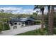 Aerial view of a well-maintained residence with manicured lawns, a modern roof, and mature landscaping at 345 W Gardenia Dr, Phoenix, AZ 85021