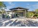 Inviting front entrance features double doors, a covered porch, and modern architectural details at 345 W Gardenia Dr, Phoenix, AZ 85021