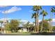 Charming home with lush landscaping and palm trees creates a welcoming curb appeal at 345 W Gardenia Dr, Phoenix, AZ 85021