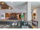 Open kitchen with custom counters, flowing to the fireplace and living space at 345 W Gardenia Dr, Phoenix, AZ 85021