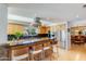 Gourmet kitchen features custom cabinetry, granite countertops, and a central island with bar seating at 345 W Gardenia Dr, Phoenix, AZ 85021