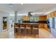 Gourmet kitchen boasts custom cabinetry, granite countertops, and a central island with bar seating at 345 W Gardenia Dr, Phoenix, AZ 85021