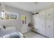 Functional laundry room with a side-by-side washer and dryer and built-in cabinets at 345 W Gardenia Dr, Phoenix, AZ 85021