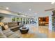 The living room features a large sectional sofa, hardwood floors, patio access, and a bar at 345 W Gardenia Dr, Phoenix, AZ 85021