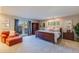 Large main bedroom with a sitting area, wood furniture, and access to the backyard at 345 W Gardenia Dr, Phoenix, AZ 85021