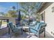 Outdoor patio with comfortable seating, a barbecue grill, and stylish decor at 345 W Gardenia Dr, Phoenix, AZ 85021
