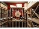 Custom wine cellar with wooden racks filled with wine bottles and a wine tasting area at 345 W Gardenia Dr, Phoenix, AZ 85021