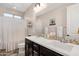 Bright bathroom with double sinks, granite countertops, and modern fixtures at 3709 E Stiles Ln, Gilbert, AZ 85295