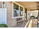 Inviting front porch area with seating, creating a warm and welcoming entrance to the home at 3709 E Stiles Ln, Gilbert, AZ 85295