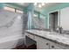 Bright bathroom with a marble countertop, shower and tub combination at 3899 S Chaparral Rd, Apache Junction, AZ 85119