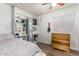 Well-organized bedroom with a built in desk and wood floors at 3899 S Chaparral Rd, Apache Junction, AZ 85119