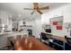 Open kitchen with granite countertops, white cabinetry, and wood flooring at 3899 S Chaparral Rd, Apache Junction, AZ 85119
