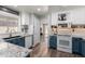 Updated kitchen featuring white cabinets and tile backsplash, adjacent to the dining area at 3899 S Chaparral Rd, Apache Junction, AZ 85119
