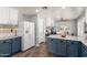 Renovated kitchen with gray granite countertops, blue cabinetry, and modern appliances at 3899 S Chaparral Rd, Apache Junction, AZ 85119