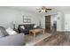 Comfortable living room featuring wood-look tile flooring, barn door, and natural light at 3899 S Chaparral Rd, Apache Junction, AZ 85119