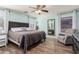 Comfortable bedroom with wood floors, ensuite bath, and sitting area at 3899 S Chaparral Rd, Apache Junction, AZ 85119