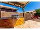 Outdoor kitchen with a built-in BBQ and spacious countertops at 3899 S Chaparral Rd, Apache Junction, AZ 85119