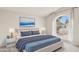Beautifully staged bedroom featuring a comfortable king bed and an arched window at 3948 W Butler St, Chandler, AZ 85226