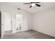Neutral bedroom with a ceiling fan and access to a private bathroom at 3948 W Butler St, Chandler, AZ 85226