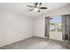 Spacious bedroom with neutral walls, carpet, and a large window at 3948 W Butler St, Chandler, AZ 85226
