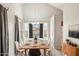 Dining area featuring stylish table, chairs, and large window at 3948 W Butler St, Chandler, AZ 85226